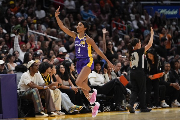Los Angeles Sparks guard Lexie Brown celebrates a three-point basket during the first half of a WNBA basketball game against the Las Vegas Aces, Sunday, June 9, 2024, in Los Angeles. (AP Photo/Ryan Sun)