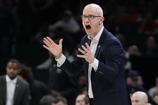 FILE - UConn head coach Dan Hurley calls towards his players during the first half of the Elite 8 college basketball game against Illinois in the men's NCAA Tournament, Saturday, March 30, 2024, in Boston. The Los Angeles Lakers’ reported plan to offer a massive contract to UConn coach Dan Hurley is the latest twist in the monthlong race to replace Darvin Ham. (AP Photo/Steven Senne, File)