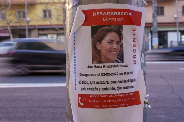 A banner of a Colombian-born American missing woman Ana Maria Knezevich Henao, 40, is displayed on a streetlight in Madrid, Spain, Friday, Feb. 16, 2024. Spanish police are looking for an Colombian-born American woman who has been reported missing in Madrid since early February. A police spokeswoman said a friend of Ana Maria Knezevich Henao, 40, filed a a missing persons complaint in a Madrid city center station on Feb. 4. (AP Photo/Manu Fernandez)