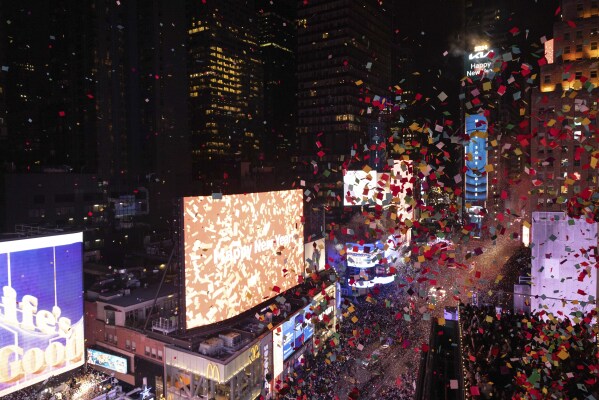 Confetti drops over the crowd as the clock strikes midnight as seen from the New York Marriott Marquis during the New Year's Eve celebration in Times Square, late Sunday/early Monday, Jan. 1, 2024, in New York. (AP Photo/Yuki Iwamura)