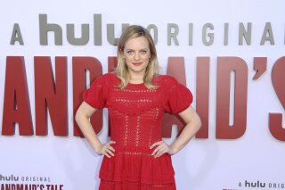 FILE - In this Tuesday, Aug. 6, 2019, file photo, Elisabeth Moss attends the "The Handmaid's Tale" season three finale red carpet at the Regency Village Theatre, in Los Angeles. The drama series’ fourth season begins April 28, 2021, and will include 10 episodes. (Photo by Willy Sanjuan/Invision/AP, File)