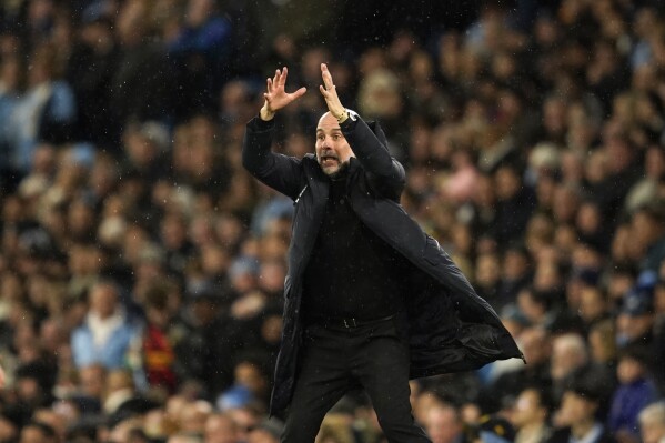 Manchester City's head coach Pep Guardiola gives instructions during the FA Cup quarterfinal soccer match between Manchester City and Newcastle at the Etihad Stadium in Manchester, England, Saturday, March 16, 2024. (AP Photo/Dave Thompson)