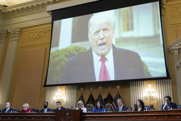 FILE - A video of President Donald Trump is shown on a screen, as the House select committee investigating the Jan. 6 attack on the U.S. Capitol holds a hearing at the Capitol in Washington, July 21, 2022. The House committee investigating the Capitol riot will hold its final meeting Monday, Dec. 19, wrapping up its year-and-a-half-long inquiry by asking the Justice Department to investigate potential crimes. (AP Photo/J. Scott Applewhite, File)