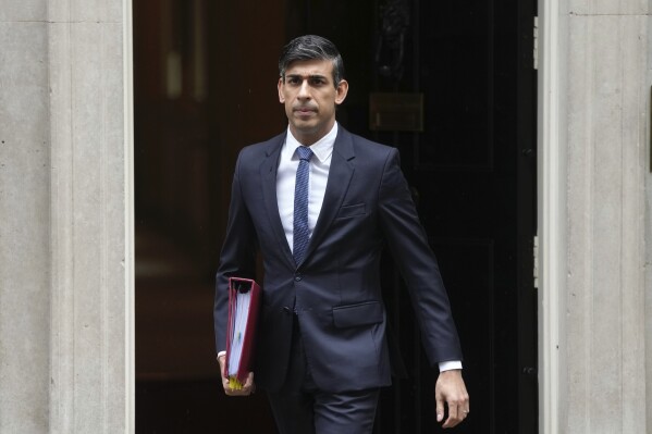 Britain's Prime Minister Rishi Sunak leaves 10 Downing Street to go to the House of Commons, London, for the weekly Prime Minister's Questions, Wednesday, Oct. 18, 2023. (AP Photo/Kin Cheung)