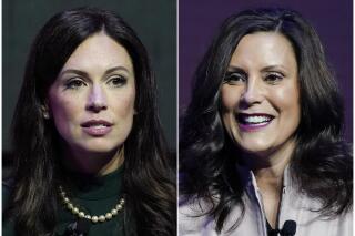 This combination of photos shows Michigan Republican gubernatorial candidate Tudor Dixon, left, and Michigan Gov. Gretchen Whitmer at the Detroit Economic Club, on Oct. 21, 2022, in Detroit. (AP Photo/Carlos Osorio)