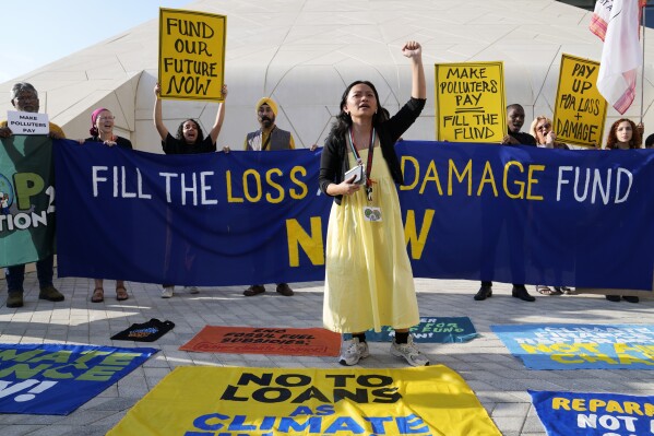 FILE - Activists participate in a demonstration for loss and damage at the COP28 U.N. Climate Summit, Monday, Dec. 4, 2023, in Dubai, United Arab Emirates. (AP Photo/Kamran Jebreili, File)