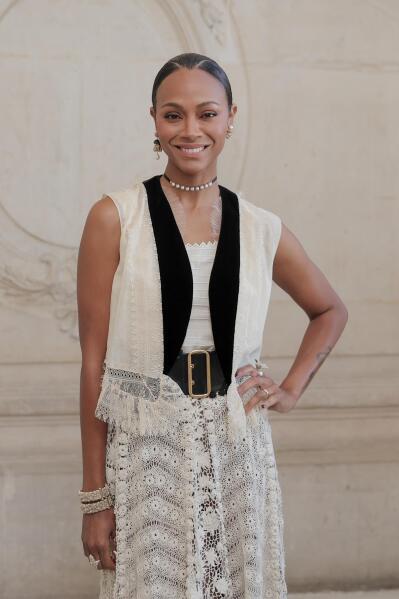 FILE - Zoe Saldana appears at the Dior Haute Couture Fall/Winter 2022-2023 fashion collection in Paris on July 4, 2022. Saldana stars in the Netflix series "From Scratch." (AP Photo/Lewis Joly, File)