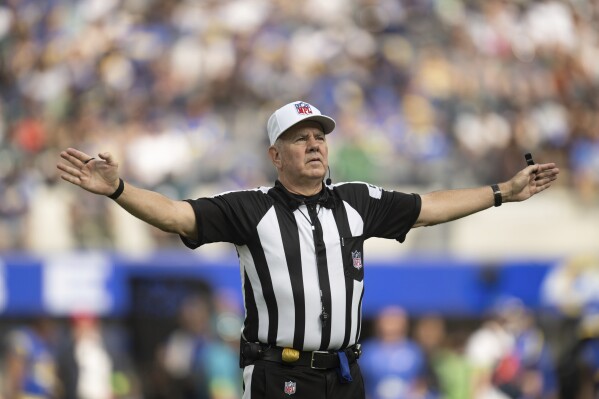 Referee Bill Vinovich gestures during an NFL football game between the Los Angeles Rams and the Philadelphia Eagles, Sunday, Oct. 8, 2023, in Inglewood, Calif. (AP Photo/Kyusung Gong)