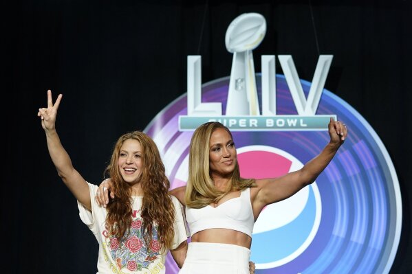 NFL Super Bowl 54 football game halftime performer Jennifer Lopez and Shakira pose for a picture after a news conference Thursday, Jan. 30, 2020, in Miami. (AP Photo/David J. Phillip)
