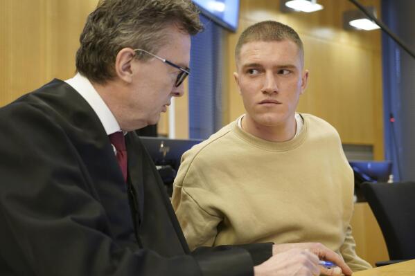 Former member of the Russian private military contractor Wagner Group Andrey Medvedev, right, listens to his lawyer Brynjulf Risnes during a court hearing in Oslo, Tuesday, April 25, 2023. Medvedev, who is seeking asylum in Norway, was Tuesday facing a Norwegian court for a bar brawl earlier this year. Medvedev has confessed to most of the charges for events in February and March but denies violence against police officers who handcuffed him outside an Oslo pub, the Norwegian news agency NTB said. (Gorm Kallestad/NTB Scanpix via AP)