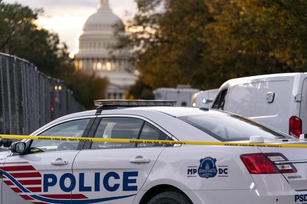FILE - Washington Metropolitan Police investigate near the Supreme Court and U.S. Capitol in Washington, Oct. 19, 2022. President Joe Biden on Thursday - the third anniversary of George Floyd's murder - vetoed an effort led by congressional Republicans to overturn a new District of Columbia law on improving police accountability. (AP Photo/J. Scott Applewhite, File)