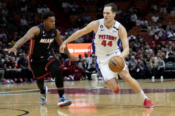 Miami Heat guard Kyle Lowry (7) defends against Detroit Pistons forward Bojan Bogdanovic (44) during the first half of an NBA basketball game Tuesday, Dec. 6, 2022, in Miami. (AP Photo/Lynne Sladky)