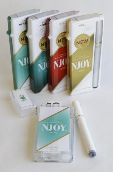 FILE - Several different versions of the NJOY electronic cigarettes are shown in Richmond, Va., Friday, March 22, 2013. Days after exiting its stake in troubled electronic cigarette maker Juul Labs, Altria announced a $2.75 billion investment in electronic cigarette startup NJOY Holdings Inc. “We believe we can responsibly accelerate U.S. adult smoker and competitive adult vaper adoption of NJOY ACE in ways that NJOY could not as a standalone company,” Altria CEO Billy Gifford said in a statement on Monday, March 6, 2023. (AP Photo/Steve Helber, File)