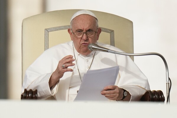 FILE - Pope Francis speaks during his weekly general audience in St. Peter's Square at The Vatican, on Oct. 18, 2023. A famous priest-artist who was thrown out of the Jesuits after being accused of sexual, spiritual and psychological abuse of women has been accepted into a diocese in his native Slovenia. The Jesuits said Thursday, Oct. 26, 2023 they had provided the diocese of Koper, Slovenia an “extensive letter” outlining the allegations against the Rev. Marko Ivan Rupnik and notice that he had been convicted and excommunicated for committing one of the most serious crimes in the Catholic Church. (AP Photo/Alessandra Tarantino, File)