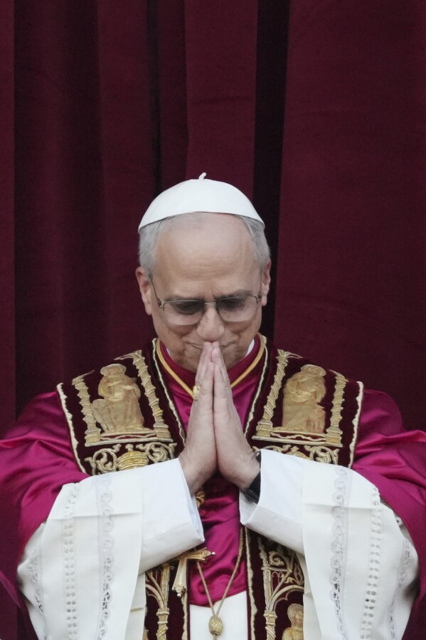 Newly elected Pope Leo XIV appears at the balcony of St. Peter's Basilica at the Vatican, Thursday, May 8, 2025. (AP Photo/Alessandra Tarantino)