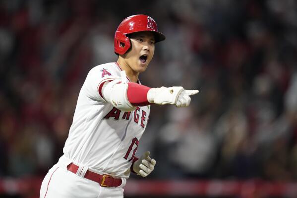 Los Angeles Angels designated hitter Shohei Ohtani (17) reacts as he runs the bases after hitting a grand slam home run during the seventh inning of a baseball game against the Tampa Bay Rays in Anaheim, Calif., Monday, May 9, 2022. Andrew Velazquez, Brandon Marsh, and Mike Trout also scored. (AP Photo/Ashley Landis)