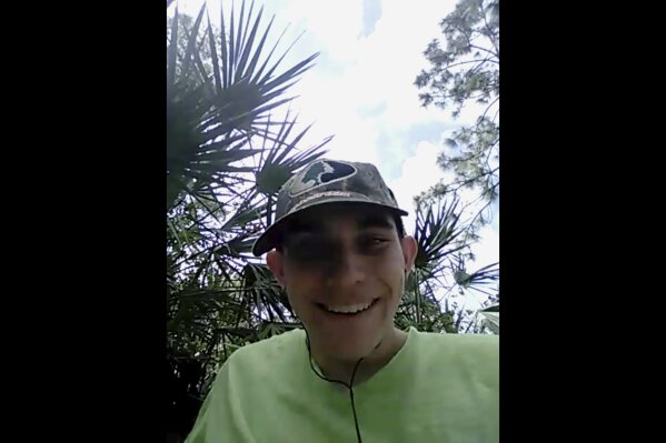 
              In this image made from one of three videos released Wednesday, May 30, 2018, by the Broward County State Attorney's Office, Nikolas Cruz, the suspect in February's shooting at a Florida high school, laughs as he announces his intention to become the next school shooter, aiming to kill at least 20 people. The videos were found on Cruz's cellphone after the Feb. 14 shooting at Marjory Stoneman Douglas High School that killed 17 people and injured 17 others. (Broward County State Attorney's Office via AP)
            