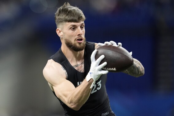 FILE - Florida wide receiver Ricky Pearsall runs a drill at the NFL football scouting combine, Saturday, March 2, 2024, in Indianapolis. The former Florida standout is one of nearly a dozen receivers expected to be selected in the first two rounds of the draft beginning Thursday night. (AP Photo/Michael Conroy, File)
