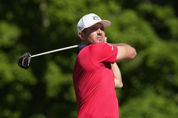 Bryson DeChambeau hits from the 18th tee during the second round of the Memorial golf tournament Friday, June 3, 2022, in Dublin, Ohio. (AP Photo/Darron Cummings)