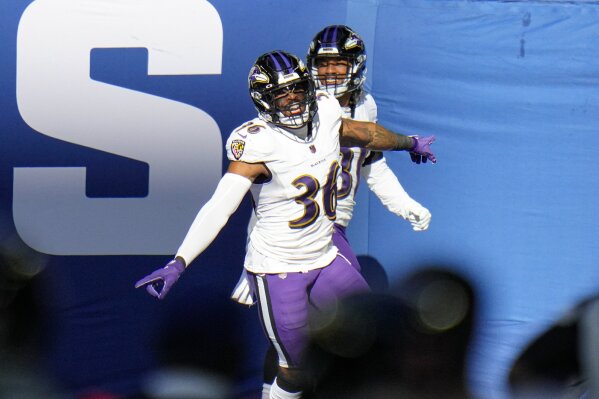 Baltimore Ravens strong safety Chuck Clark (36) celebrates after running in for a touchdown on a fumble recovery against the Indianapolis Colts in the first half of an NFL football game in Indianapolis, Sunday, Nov. 8, 2020. (AP Photo/AJ Mast)