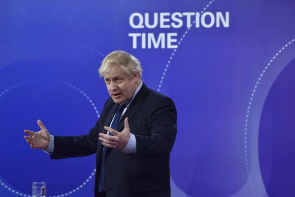 Britain's Prime Minister Boris Johnson gestures, during a BBC Question Time live election debate, in Sheffield, England, Friday, Nov. 22, 2019. ( Jeff Overs/BBC via AP)