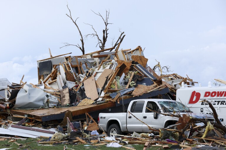 Damage is seen to home after it was leveled by a tornado near Omaha, Neb., on Friday, April 26, 2024. (Nikos Frazier/Omaha World-Herald via AP)