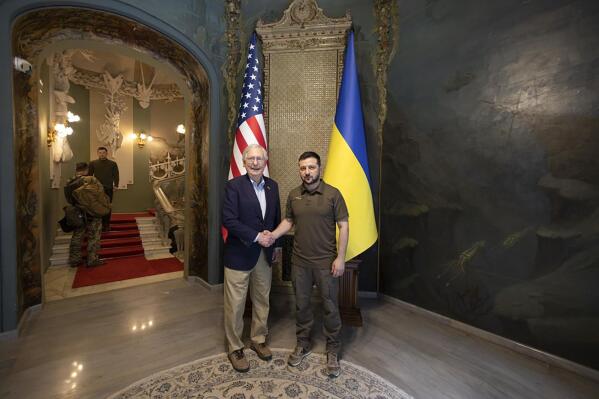 In this photo provided by the Ukrainian Presidential Press Office, Ukrainian President Volodymyr Zelenskyy, right, and Senate Minority Leader Mitch McConnell, R-Ky., pose for a photo in Kyiv, Ukraine, Saturday, May 14, 2022. (Ukrainian Presidential Press Office via AP)