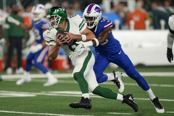 New York Jets quarterback Aaron Rodgers (8) is sacked by Buffalo Bills defensive end Leonard Floyd (56) during the first quarter of an NFL football game, Monday, Sept. 11, 2023, in East Rutherford, N.J. (AP Photo/Seth Wenig)