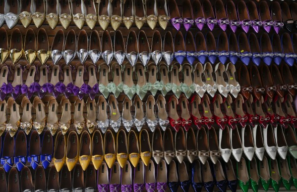 Shoes used with "La Morenada" dance costumes are on display for sale ahead of the annual Feast of the Lord of Great Power in La Paz, Bolivia, Wednesday, May 22, 2024. (AP Photo/Juan Karita)