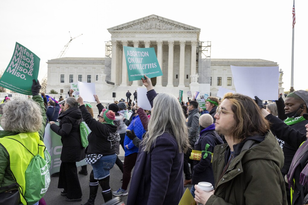 FILE - Abortion-rights groups march outside the Supreme Court, March 26, 2024, in Washington. The U.S. Supreme Court will hear arguments Wednesday in a case that could determine whether doctors can provide abortions to pregnant women with medical emergencies in states that enact abortion bans. (AP Photo/Amanda Andrade-Rhoades, File)