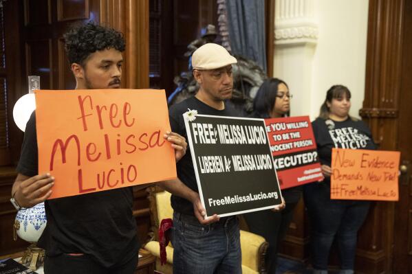 Supporters of death row inmate Melissa Lucio, including Justin Rosario, left to right, Mark Anthony Vasquez, April Agosto and Amerika Leija, wait in the Governor's Public Reception Room at the Capitol, in Austin, Texas, on Monday April 25, 2022, for a decision from the Board of Pardons and Paroles about her clemency. ( Jay Janner/Austin American-Statesman via AP)
