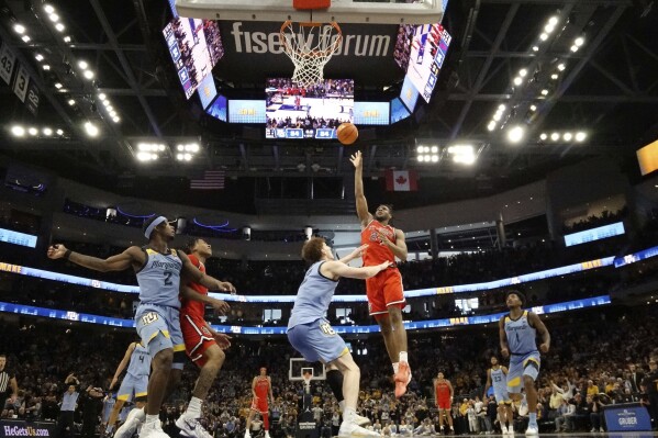 St. John's's Zuby Ejiofor makes the game-winning shot in overtime of an NCAA college basketball game against Marquette, Saturday, March 8, 2025, in Milwaukee. (AP Photo/Morry Gash)