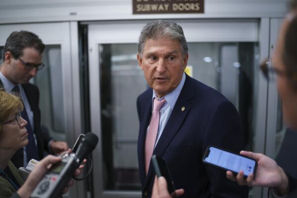 Sen. Joe Manchin, D-W.Va., a key infrastructure negotiator, pauses for reporters after working behind closed doors with other Democrats in a basement room at the Capitol in Washington, Wednesday, June 16, 2021. (AP Photo/J. Scott Applewhite)