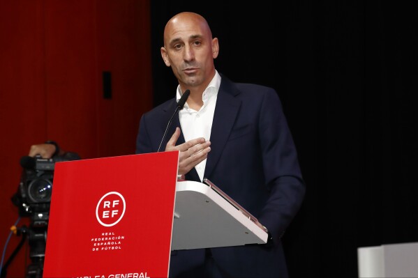 The president of the Spanish soccer federation Luis Rubiales speaks during an emergency general assembly meeting in Las Rozas, Friday Aug. 25, 2023. Rubiales has refused to resign despite an uproar for kissing a player, Jennifer Hermoso on the lips without her consent after the Women's World Cup final. Rubiales had also grabbed his crotch in a lewd victory gesture from the section of dignitaries with Spain's Queen Letizia and the 16-year old Princess Sofía nearby. (Real Federación Española de Fútbol/Europa Press via AP)