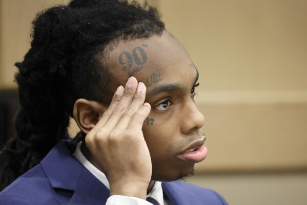 Jamell Demons, better known as rapper YNW Melly, is shown at the defense table during closing arguments in his trial at the Broward County Courthouse in Fort Lauderdale, Fla., on Thursday, July 20, 2023. Demons, 22, is accused of killing two fellow rappers and conspiring to make it look like a drive-by shooting in October 2018. (Amy Beth Bennett/South Florida Sun-Sentinel via AP)