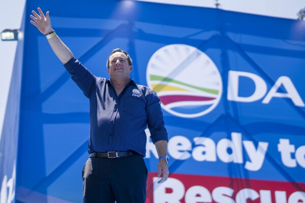 Opposition Democratic Alliance party leader john Steenhuisen waves at supporters in Pretoria, South Africa, Saturday, Feb. 17, 2024, for their national manifesto launch in anticipation of the 2024 general elections. (AP Photo/Jerome Delay)