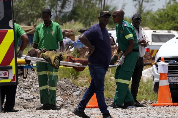Dozens of survivors and dead pulled from abandoned South African mine as hundreds remain underground | AP News