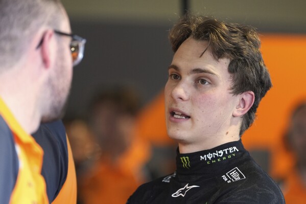 McLaren driver Oscar Piastri of Australia talks with his team after a practice session for the Formula One Miami Grand Prix auto race, Friday, May 2, 2025, in Miami Gardens, Fla. (AP Photo/Rebecca Blackwell)