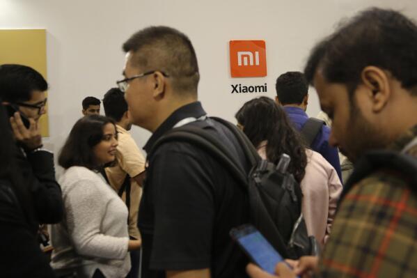 Guests gather to check out Xiaomi's newly launched products at an event in Bangalore, India, Tuesday, Sept. 17, 2019. Indian authorities on Saturday, April 30, 2022, seized $725 million from Chinese smartphone company Xiaomi after an investigation found it had broken the country's foreign exchange laws by making illegal remittances abroad, officials said. (AP Photo/Aijaz Rahi, File)