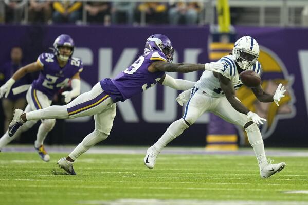 Indianapolis Colts wide receiver Ashton Dulin catches a pass ahead of Minnesota Vikings cornerback Chandon Sullivan (39) during the second half of an NFL football game, Saturday, Dec. 17, 2022, in Minneapolis. (AP Photo/Abbie Parr)