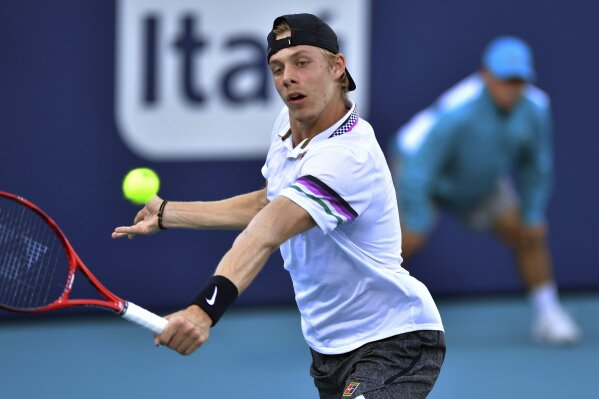 
              FILE - In this Thursday, March 28, 2019 file photo, Denis Shapovalov, of Canada, hits a backhand to Frances Tiafoe, of the United States, at the Miami Open tennis tournament in Miami Gardens, Fla. Denis Shapovalov’s clay-court campaign got off to a poor start as he lost 5-7, 6-3, 6-1 to Jan-Lennard Struff in the first round of the Monte Carlo Masters on Monday, April 15, 2019.(AP Photo/Jim Rassol, file)
            
