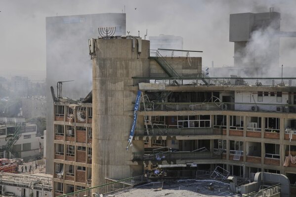 Smokes rises from a building of the Soroka hospital complex after it was hit by a missile fired from Iran in Beersheba, Israel, Thursday, June 19, 2025. (AP Photo/Leo Correa)