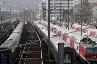 FILE - Trains are parked at a station in Vienna, Austria, Friday, March 27, 2020. Two people were charged in Austria for allegedly playing speeches by Adolf Hitler via the loudspeaker system of a train running from Bregenz to Vienna, Austrian news agency APA reported Monday, May 15, 2023. (AP Photo/Ronald Zak, File)