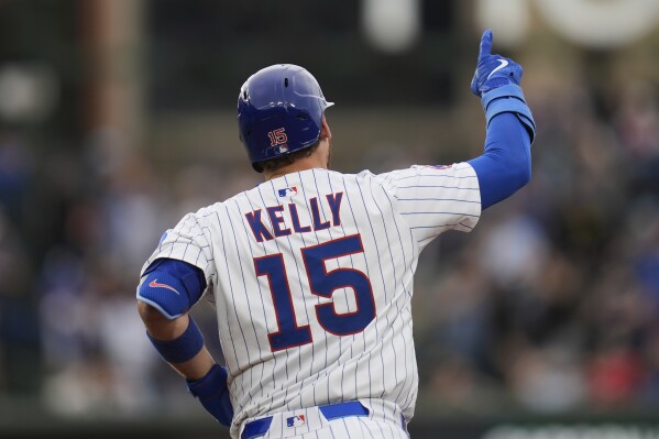 Chicago Cubs' Carson Kelly (15) runs the bases after hitting a two-run home run during the second inning of a baseball game against the Arizona Diamondbacks, Friday, April 18, 2025, in Chicago. (AP Photo/Erin Hooley)