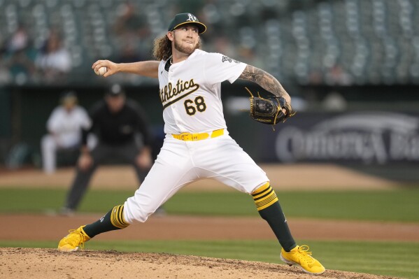 Oakland Athletics pitcher Joey Estes works against the Seattle Mariners during the seventh inning of a baseball game in Oakland, Calif., Wednesday, June 5, 2024. (AP Photo/Jeff Chiu)