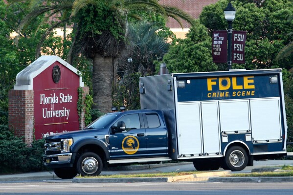 Crime scene vehicle at the Woodward Avenue entrance to the Florida State University campus after a shooting, in Tallahassee, Fla., Thursday, April 17, 2025. (AP Photo/Gary McCullough)