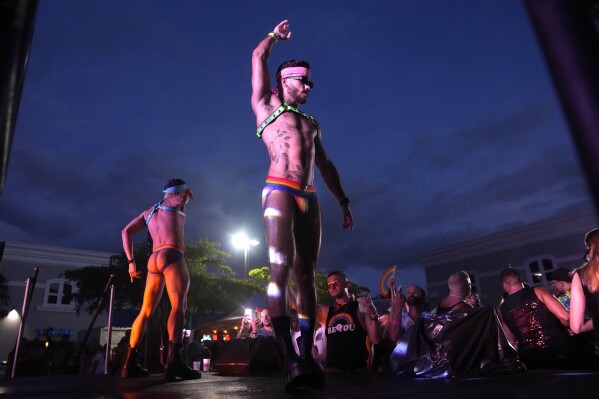 Dancers perform on a stage during the Stonewall Pride Parade and Street Festival, Saturday, June 17, 2023, in Wilton Manors, Fla. (AP Photo/Lynne Sladky)