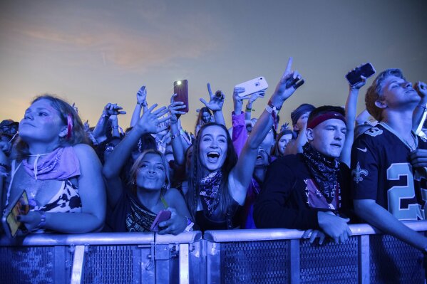 FILE - In this Sunday, Oct. 27, 2019, file photo, festival-goers attend the Voodoo Music Experience in City Park in New Orleans. Major concert promoters in the U.S. are stepping back from plans to scan festival-goers with facial recognition technology, at least for the time being. Voodoo Music confirmed that they don't use facial recognition technology. (Photo by Amy Harris/Invision/AP, File)
