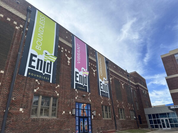 Banners hang outside an arena in Enid, Okla., Tuesday, March 26, 2024. Enid City Councilmember Judd Blevins, who has acknowledged ties to white supremacist groups, is facing a recall vote, Tuesday, April 2, 2024. (AP Photo/Sean Murphy)
