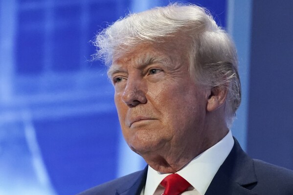 FILE - Former President Donald Trump arrives to speak at the Moms for Liberty meeting in Philadelphia, Friday, June 30, 2023. A Georgia prosecutor is expected to seek a grand jury indictment in the coming weeks in her investigation into efforts by Donald Trump and his allies to overturn the former president’s 2020 election loss. Fulton County District Attorney Fani Willis began investigating more than two years ago, shortly after a recording was released of a January 2021 phone call Trump made to Georgia’s secretary of state. (AP Photo/Matt Rourke, File)